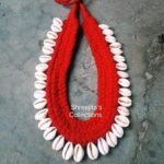 fabric necklace with cowrie shell