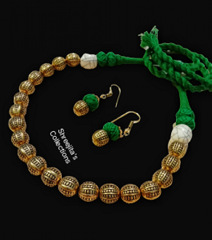 antique gold tone tribal green thread necklace